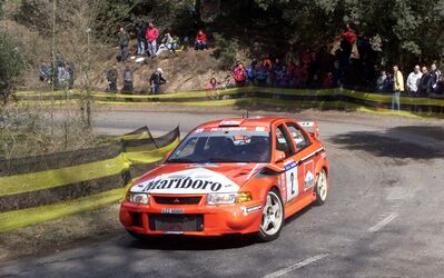Freddy Loix - Sven Smeets
36º Rallye Catalunya - Costa Brava - Rallye de España 2000. Mitsubishi Lancer Evo VI (V22 MMR). Clasificado 8º.

Del 30 de Marzo al 2 de Abril, Lloret de Mar, Girona, Catalunya, España.
Superficie: asfalto.

El Rally tenia un total de 1874.7 km de los que 383.09 km divididos en 15 tramos eran especiales.

Se inscribieron 95 equipos, tomaron la salida 91, finalizaron 55.@
Palabras clave: Catalunya;Costa_Brava;España;Spain;Mitsubishi;Lancer;Evo;2000