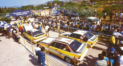 31º Rothmans Acropolis Rally 1984
Verificaciones técnicas del Equipo Audi Sport en los 4 Audi que inscribió el Equipo en la prueba.

#1 Audi Sport Quattro S1 (IN-NC 46) de Walter Röhrl - Christian Geistdörfer, abandonó por el embrague en SS44 Geraki de 11.32 Km.

 #4 Audi Sport Quattro S1 (IN-NL 2) de Michele Mouton - Fabrizia Pons, abandonó por motor en SS14 Makrirahi de 15.53 Km.

7# Audi Quattro A2 (IN-NL 1) de Hannu Mikkola - Arne Hertz, clasificado 2º.

10# Audi Quattro A2 (IN-YD 29) de Stig Blomqvist - Björn Cederberg, clasificado 1º.

Del 26 al 31 de Mayo, Atenas, Grecia.
Superficie: tierra.

El Rally tení­a un total de 2265 km, de los que 796.62 km divididos en 47 tramos eran especiales.

Tomaron la salida 104 equipos, finalizaron 32.
@
Palabras clave: Audi;Quattro;Grecia;Acropolis;1984;Grupo_B;Verificaciones