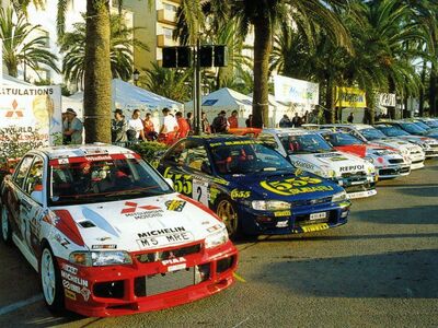 32º Rallye Catalunya - Costa Brava - Rallye de España 1996
Parque Cerrado en el Paseo Marítimo de Lloret de Mar

7# Mitsubishi Lancer Evo III (M5 MRE) de Tommi Mäkinen - Juha Repo, clasificado 5º.

2# Subaru Impreza 555 (N555 WRC) de Kenneth Eriksson - Staffan Parmander, clasificado 7º.

Del 4 al 6 de Noviembre, Lloret de Mar, Girona, Catalunya, España.
Superficie: asfalto.

El Rally tenia un total de 1368.76 km de los que 393.26 km divididos en 18 tramos, eran especiales.

Tomaron la salida 88 equipos, finalizaron 58.
@
Palabras clave: Subaru;Impreza;Catalunya;España;Spain;1996;Parque_Cerrado;Mitsubishi;Lancer