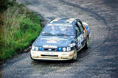 François Delecour - Anne-Chantal Pauwels
25º Rallye de Portugal - Vinho do Porto 1991. Ford Sierra RS Cosworth 4x4 (H378 JEV). Abandonó por accidente en SS11 Freita de 24.20 km.

Del 5 al 9 de Marzo, Portugal.
Superficie: asfalto - tierra.

El Rally tenia un total de 2041.26 Km de los que 564.20 Km divididos en 38 tramos eran especiales (2 de ellos fueron cancelados SS2 Gradil de 9 Km y SS28 Viseu de 29.90 Km).

Se inscribieron 106 equipos, tomaron la salida 95, finalizaron 28.@
Palabras clave: ;Ford;Sierra;RS;Cosworth;Portugal;1991
