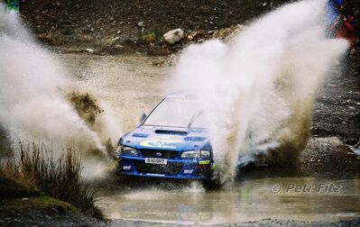 Juha Kankkunen - Juha Repo
55º Network Q Rally de Gran Bretaña 1999. Subaru Impreza S5 WRC '99 (S 10 SRT). Clasificado 2º.

Del 21 al 23 de Noviembre, Cheltenham.
Superficie: tierra - asfalto.

El Rally tení­a un total de 1815.48 km de los que 389.39 km divididos en 22 tramos eran especiales.

Se inscribieron 186 equipos, tomaron la salida 160, finalizaron 89.

© Petr Fitz
@@
Palabras clave: ;Gran_Bretaña;Subaru;Impreza;WRC;1999
