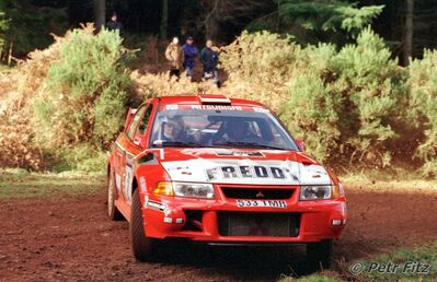 Freddy Loix - Sven Smeets
55º Network Q Rally de Gran Bretaña 1999. Mitsubishi Lancer Evo VI (S33 TMR). Clasificado 5º.

Del 21 AL 23 de Noviembre, Cheltenham.
Superficie: tierra - asfalto.

El Rally tení­a un total de 1815.48 km de los que 389.39 km divididos en 22 tramos eran especiales.

Se inscribieron 186 equipos, tomaron la salida 160, finalizaron 89.

© Petr Fitz
@@
Palabras clave: Mitsubishi;Lancer;Gran_Bretaña;1999;WRC