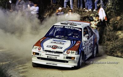 Gianfranco Cunico - Stefano Evangelisti
36º Rallye San Remo - Rallye de Italia 1994. Ford Escort RS Cosworth (L 344 MRM). Clasificado 6º.

Del 9 al 13 de Octubre, Sanremo, Liguria, Imperia, Italia.
Superficie: asfalto - tierra.

El Rally tenia un total de 2160.40 km de los que 526.03 km divididos en 26 tramos eran especiales (una de ellas fue cancelada SS17 Roncola de 9.40 km).

Se inscribieron 94 equipos, tomaron la salida 92, finalizaron 40.

© Stéphane Lhonnay
@
Palabras clave: ;Ford;Escort;Cosworth;Sanremo;1994