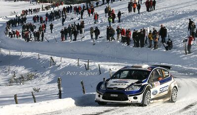 Mikko Hirvonen - Jarmo Lehtinen
78º Rallye Automobile de Monte-Carlo 2010. Ford Fiesta S2000 (MM59 ORT). Clasificado 1º.

Del 19 al 23 de Enero, Valence - Monaco.
Superficie: asfalto - nieve

El Rally tenia un total de 396.18 km cronometrados divididos en 3 etapas y 15 tramos especiales.

Tomaron la salida 59 equipos, finalizaron 36.

© Petr Sagner
@@
Palabras clave: ;Jarmo_Lehtinen;Ford;Fiesta;Montecarlo;2010