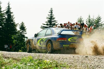 Juha Kankkunen - Juha Repo
47º Acrópolis Rally 2000. Subaru Impreza S6 WRC 00 (W19 SRT). Clasificado 3º.
Foto en SS19 Stromi 2 de 22.82 km.

Del 8 al 11 de Junio, Atenas, Itea.
Superficie: tierra.

El Rally constaba de 3 etapas con un total de 1407.56 km de los que 390.27 km divididos en 19 tramos eran especiales.

Tomaron la salida 117 equipos, finalizaron 48.@
Palabras clave: ;Acropolis;Grecia;Subaru;Impreza;WRC;2000