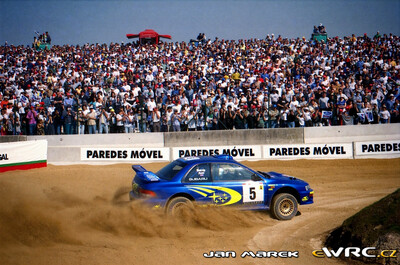 Richard Burns - Robert Reid
33º TAP Rallye de Portugal 1999. Subaru Impreza S5 WRC '99 (S9 SRT). Clasificado 4º.
Subaru World Rally Team

Del 21 al 24 de Marzo, Matosinhos, Porto, Portuigal.
Superficie: tierra.

El Rally tení­a un total de 1768.61 km de los que 399.51 km divididos en 23 tramos eran especiales (dos de ellos fueron cancelados SS18 Arganil - Coja 2 de 20.96 km y SS19 Salgueiro - Gois 2 de 19.70 km).

Se inscribieron 117 equipos, tomaron la salida 117, finalizaron 56.

© Jan Marek
@@
Palabras clave: Subaru;Impreza;WRC;Portugal;2007
