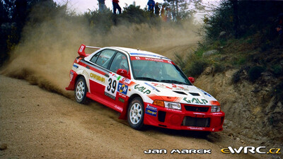 Miguel Campos - Miguel Ramalho
33º TAP Rallye de Portugal 1999. Mitsubishi Carisma GT Evo V (99-06-MQ). Clasificado 12º.

Del 21 al 24 de Marzo, Matosinhos, Porto, Portuigal.
Superficie: tierra.

El Rally tení­a un total de 1768.61 km de los que 399.51 km divididos en 23 tramos eran especiales (dos de ellos fueron cancelados SS18 Arganil - Coja 2 de 20.96 km y SS19 Salgueiro - Gois 2 de 19.70 km).

Se inscribieron 117 equipos, tomaron la salida 117, finalizaron 56.

© Jan Marek
@@
Palabras clave: Mitsubishi;Carisma;Portugal;1999