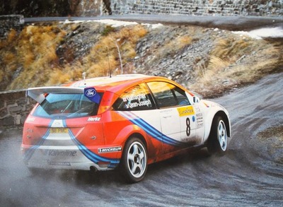 Simon Jean-Joseph - Fred Gallagher
67º Rallye Automobile de Monte-Carlo 1999. Ford Focus WRC 99 (S8 FMC). Finalizó 10º pero fue descalificado por considerarse que la bomba de agua era ilegal.

Del 17 al 20 de Enero, Monte-Carlo.
Superficie: asfalto - nieve.

El Rally tenia un total de 1613.20 km de los que 424.69 km divididos en 14 tramos eran especiales.

Tomaron la salida 86 equipos, finalizaron 46.@
Palabras clave: Ford;Focus;WRC;Montecarlo;1999