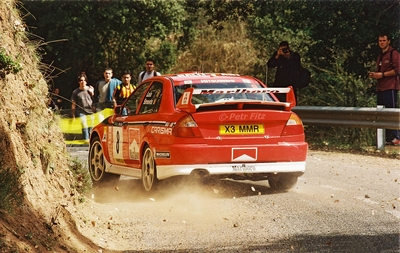 Freddy Loix - Sven Smeets
37º Rallye Catalunya - Costa Brava - Rallye de España 2001. Mitsubishi Carisma GT Evo VI (X3 MMR). Clasificado 4º.
Marlboro Mitsubishi Ralliart

Del 22 al 25 de Marzo, Lloret de Mar, Girona, Catalunya, España.
Superficie: asfalto.

El Rally tenia un total de 1779.13 km de los que 383.18 km divididos en 18 tramos eran especiales, (una de ellas fue cancelada SS12 La Riba 2 de 35.89 Km).

Se inscribieron 79 equipos, tomaron la salida 76, finalizaron 36.

© Petr Fitz
@
Palabras clave: Mitsubishi;Catalunya;Costa_Brava;España;2001;Spain