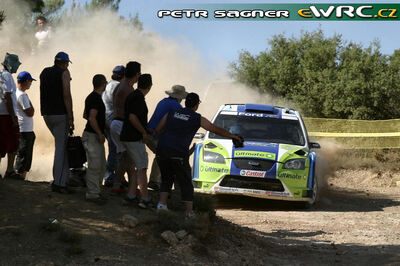 Marcus Grönholm - Timo Rautiainen
53º BP Ultimate Acropolis Rally of Greece 2006. Ford Focus RS WRC '06 (EU55 BMV). Clasificado 1º.
BP Ford World Rally Team

Del 2 al 4 de Junio, Athens.
Superficie: tierra.

El Rally constabade 3 etapas con un tenia un total de 1279.29 km de los que 355.62 km divididos en 18 tramos eran cronometrados.

Se inscribieron 91 equipos, tomaron la salida 84, finalizaron 69.

© Petr Sagner
@@
Palabras clave: Ford;Focus;WRC;Acropolis;Grecia;Atenas;2006