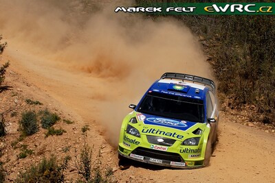 Mikko Hirvonen - Jarmo Lehtinen
41º Vodafone Rally de Portugal 2007. Ford Focus RS WRC '06 (EJ56 FZB). Clasificado 5º.
BP Ford World Rally Team

Del 30 de Marzo al 1 de Abril, Faro.
Superficie: tierra.

El Rally constaba de 3 etapas con un total de 1009.31 km de los que 357.10 km divididos en 18 tramos, eran cronometrados.

Tomaron la salida 80 equipos, finalizaron 61.

© Marek Felt
@@
Palabras clave: ;Ford;Focus;WRC;Portugal;2007