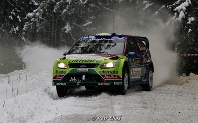 Mikko Hirvonen - Jarmo Lehtinen
58º Rally Sweden 2010. Ford Focus RS WRC '09 (BK08 LCW). Clasificado 1º.

Del 10 al 14 de Febrero, Karlstad, Suecia.
Superficie: nieve - hielo.

El Rally tenia un total de 1879.23 km de los que 345.15 km divididos en 3 etapas y 21 tramos eran cronometrados.

Tomaron la salida 55 equipos, finalizaron 43.

© Petr Eliáš
@
Palabras clave: ;Ford;Focus;WRC;Suecia;2010;Nieve