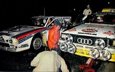 Asistencia del Equipo Audi Sport en el 18º Rally de Portugal 1984
Al lado derecho de la foto el Audi Quattro A2 (IN-NE 8) de Hannu Mikkola - Arne Hertz, clasificado 1º.

Al lado el Lancia Rally 037 (TO W67771) de Markku Alén - Ilkka Kivimäki, clasificado 2º.

Del 6 al 10 de Marzo, Estoril, Portugal.
Superficie: asfalto - tierra.

El Rally tenia un total de 2400.00 km de los que 685.00 km divididos en 45 tramos eran especiales.

Tomaron la salida 70 equipos, finalizaron 20.@
Palabras clave: Markku_Alen;Hannu_Olavi_Mikkola;Lancia;Rally;Audi;Grupo_B;Quattro;Asistencias;Portugal;1984;Personajes