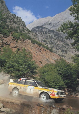 Stig Blomqvist - Björn Cederberg
32º Rothmans Acropolis Rally 1985. Audi Sport Quattro S1 (IN-NA 23). Clasificado 2º.

Del 27 al 30 de Mayo, Atenas, Grecia.
Superficie: tierra.

El Rally tenía un total de 2295.94 km de los que 807.67 km divididos en 47 tramos eran especiales.

Tomaron la salida 110 equipos, finalizaron 45.@
Palabras clave: Stig_Blomqvist;Audi;Sport;Quattro;Grupo_B;Acropolis;Grecia;1985