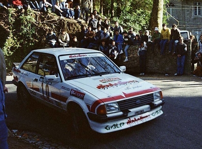 Joaquim Santos - Miguel Oliveira
19º Rallye de Portugal - Vinho do Porto 1985. Ford Escort RS1600i (DJ-80-70). Clasificado 13º.

Del 6 al 9 de Marzo, Estoril, Portugal.
Superficie: asfalto - tierra.

El Rally tení­a un total de 2455 km de los que 730.50 km divididos en 47 tramos eran especiales.

Tomaron la salida 94 equipos, finalizaron 28.@
Palabras clave: Ford;Escort;Portugal;1985