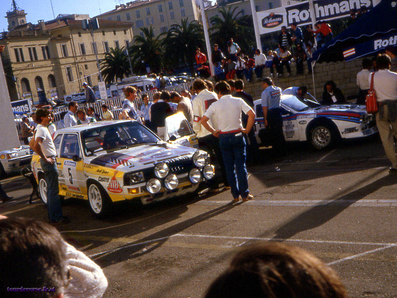 Parque Cerrado del 29º Tour de Corse - Rallye de France 1985
En primer plano el Audi Sport Quattro S1 (IN-NT 61) de Walter Röhrl - Christian Geistdörfer. Abandonó por los frenos en SS1 Verghia - Pont de la Masina de 38,09 Km.

Al lado el Lancia Rally 037 (TO-W67783) de Markku Alén - Ilkka Kivimäki. Abandonó por el fatal accidente de su compañero de Equipo Attilio Bettega (D.E.P./R.I.P.) en SS4 Zerubia - Santa Giulia de 30.60 km.

Del 2 al 4 de Mayo, Ajaccio, Córcega, Francia.
Superficie: asfalto.

El Rally tenia un total de 1603.00 km de los que 1122.25 km divididos en 30 tramos eran especiales, (1 de ellos fue cancelado, SS5 Sartene - Zonza de 44.23 km, por el fatal accidente en el tramo anterior de Attilio Bettega).

Tomaron la salida 139 equipos, finalizaron 45.
@
Palabras clave: Markku_Alen;Walter_Röhrl;Audi;Sport;Quattro;Lancia;Rally;Grupo_B;Corcega;1985;Parque_Cerrado;Corse