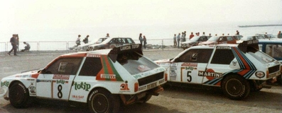 Parque Cerrado del 28º Rally San Remo 1986
Los Lancia Delta S4 de.
#8 (TO 90679E) Dario Cerrato - Giuseppe Cerri, clasificado 2º.
#5 (TO 19737F) Miki Biasion - Tiziano Siviero, clasificado 3º.

Equipo Peugeot descalificado
El tercer dí­a del Rally se examinó el Peugeot y se decreto que las aletas de la parte de abajo eran en realidad faldillas. Las faldillas habí­an sido prohibidas después del Córcega, y a pesar de que los coches habí­an pasado las verificaciones pre-rally, se excluyeron todos los Peugeot de inmediato. Peugeot llevó el asunto a la FISA en diciembre, y decidió que la exclusión era ilegal.

Todos los puntos del Rally para el Campeonato se anularon, por eso Sanremo de 1986 no pudo considerarse una prueba de WRC, y por eso Markku Alén fue Campeón del Mundo durante tan solo 10 dí­as.

Del 13 al 17 de Octubre, Sanremo, Imperia, Italia.
Superficie: asfalto - tierra.

El Rally tenía un total de 2148.69 Km de los que 532.60 Km divididos en 40 tramos eran especiales (2 de ellos fueron cancelados SS8 Santa Luce de 12.30 Km y SS22 La Sela 2 de 10.15 Km).

Tomaron la salida 118 equipos, finalizaron 38.
@
Palabras clave: ;Miki_Biasion;Lancia;Delta;Sanremo;Grupo_B;1986;Parque_Cerrado
