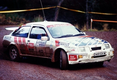 Jimmy McRae - Ian Grindrod
36º Lombard RAC Rally 1987. Ford Sierra RS Cosworth (D418 SVW). Clasificado 3º.

Del 22 al 25 de Noviembre, Chester, Inglaterra.
Superficie: tierra.

El Rally tenia un total de 2623.92 Km de los que 513.29 Km divididos en 48 tramos eran especiales, (uno de ellos fue cancelado SS22 Hafren Forest 3 de 19.42 Km).

Se inscribieron 176 equipos, tomaron la salida 165, finalizaron 83.@
Palabras clave: Jimmy_McRae;Ford;Sierra;Cosworth;Gran_Bretaña;1987;RAC_Rally;Lombard;Inglaterra