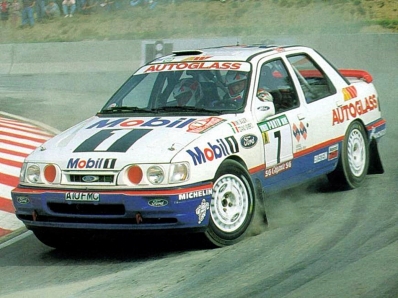 Massimo (Miki) Biasion - Tiziano Siviero
26º Rallye de Portugal - Vinho do Porto 1992. Ford Sierra RS Cosworth 4x4 (A10 FMC). Clasificado 2º.

Del 3 al 7 de Marzo, Portugal.
Superficie: tierra.

El Rally tenia un total de 2211.17 km de los que 577.38 km divididos en 40 tramos eran especiales.

Se inscribieron 114 equipos, tomaron la salida 100, finalizaron 31.@
Palabras clave: Miki_Biasion;Ford;Sierra;Cosworth;Portugal;1992