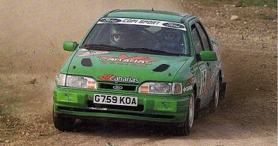 Fernando Capdevila - Alfredo Rodriguez
26º Rallye de Portugal - Vinho do Porto 1992. Ford Sierra Cosworth 4x4. Clasificado 15º.
El Rally tenia un total de 2211.17 km de los que 577.38 km divididos en 40 tramos, eran especiales.
Se inscribieron 114 equipos, tomaron la salida 100, finalizaron 31.@
Palabras clave: ;Portugal;Ford;Sierra;Cosworth;1992