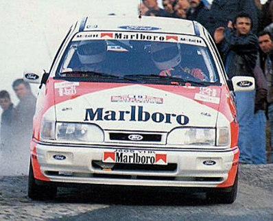 Mohammed bin Sulayem - Ronan Morgan
26º Rallye de Portugal - Vinho do Porto 1992. Ford Sierra Cosworth 4x4 (J605 YHK). Clasificado 20º.

Del 3 al 7 de Marzo, Portugal.
Superficie: tierra.

El Rally tenia un total de 2211.17 km de los que 577.38 km divididos en 40 tramos, eran especiales.

Se inscribieron 114 equipos, tomaron la salida 100, finalizaron 31.@
Palabras clave: Ford;Sierra;Cosworth;Portugal;1992