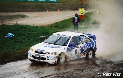 Bruno Thiry - Stéphane Prévot
54º Network Q Rally de Gran Bretaña 1998. Ford Escort WRC (P9 FMC). Clasificado 3º.

Del 22 al 24 de Noviembre, Cheltenham, Inglaterra.
Superficie: tierra - asfalto.

El Rally tenia un total de 1175.90 km de los que 383.85 km divididos en 28 tramos eran especiales.

Tomaron la salida 168 equipos, finalizaron 82.

© Petr Fitz
@
Palabras clave: Bruno_Thiry;Ford;Escort;WRC;Gran_Bretaña;1998;Inglaterra