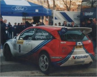 Simon Jean-Joseph - Fred Gallagher
67º Rallye Automobile de Monte-Carlo 1999. Ford Focus WRC 99 (S8 FMC). Finalizó 10º pero fue descalificado por considerarse que la bomba de agua era ilegal.

Del 17 al 20 de Enero, Monte-Carlo.
Superficie: asfalto - nieve.

El Rally tenia un total de 1613.20 km de los que 424.69 km divididos en 14 tramos eran especiales.

Tomaron la salida 86 equipos, finalizaron 46.@
Palabras clave: Ford;Focus;WRC;Montecarlo;1999