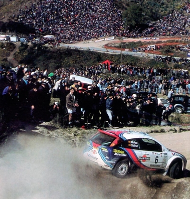 Carlos Sainz Cenamor - Lui­s Moya
34º TAP Rallye de Portugal 2000. Ford Focus RS WRC '00 (V4 FMC). Clasificado 3º.

Del 16 al 19 de Marzo, Matosinhos, Porto, Portugal.
Superficie: tierra.

El Rally tenia un total de 1,646.96 Km de los que 398.35 Km divididos en 23 tramos eran especiales.

Se inscribieron 117 equipos, tomaron la salida 114, finalizaron 48.@
Palabras clave: ;Luis_Moya;Ford;Focus;WRC;Portugal;2000