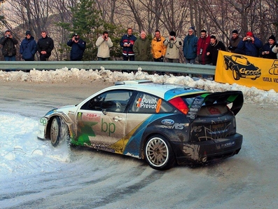 François Duval - Stéphane Prévot
72º Rallye Automobile de Monte-Carlo 2004. Ford Focus RS WRC 03 (EK52 NWN). Clasificado 3º.

Del 23 al 25 de Enero, Monaco.
Superficie: asfalto.

El Rally tenia un total de 1,331.92 Km de los que 389.12 Km divididos en 15 tramos, eran especiales (2 de ellos fueron cancelados SS1 Selonnet - Breziers 1 de 22.64 Km y SS10 Tourette du Chateau - St Antonin 2 de 24.80 Km. Uno de ellos se dio con tiempo de tramo teórico a todos los equipos, SS8 Tourette du Chateau - St Antonin 1 de 24.80 Km).

Se inscribieron 45 equipos, tomaron la salida 43, finalizaron 20.@
Palabras clave: Ford;Focus;WRC;Montecarlo;2004;nieve